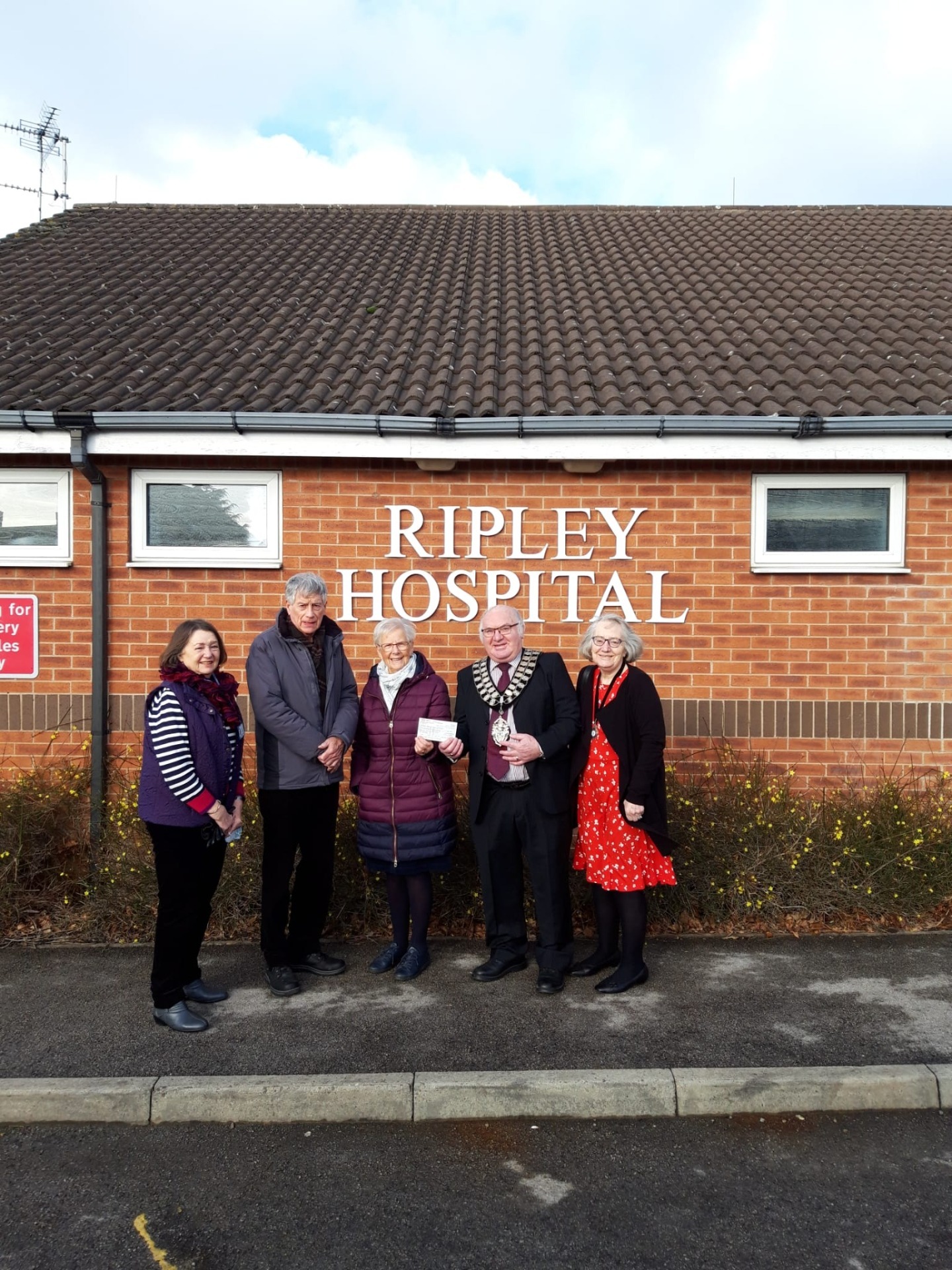 Mayor of Ripley and others stood outside Ripley Hospital for a cheque presentation